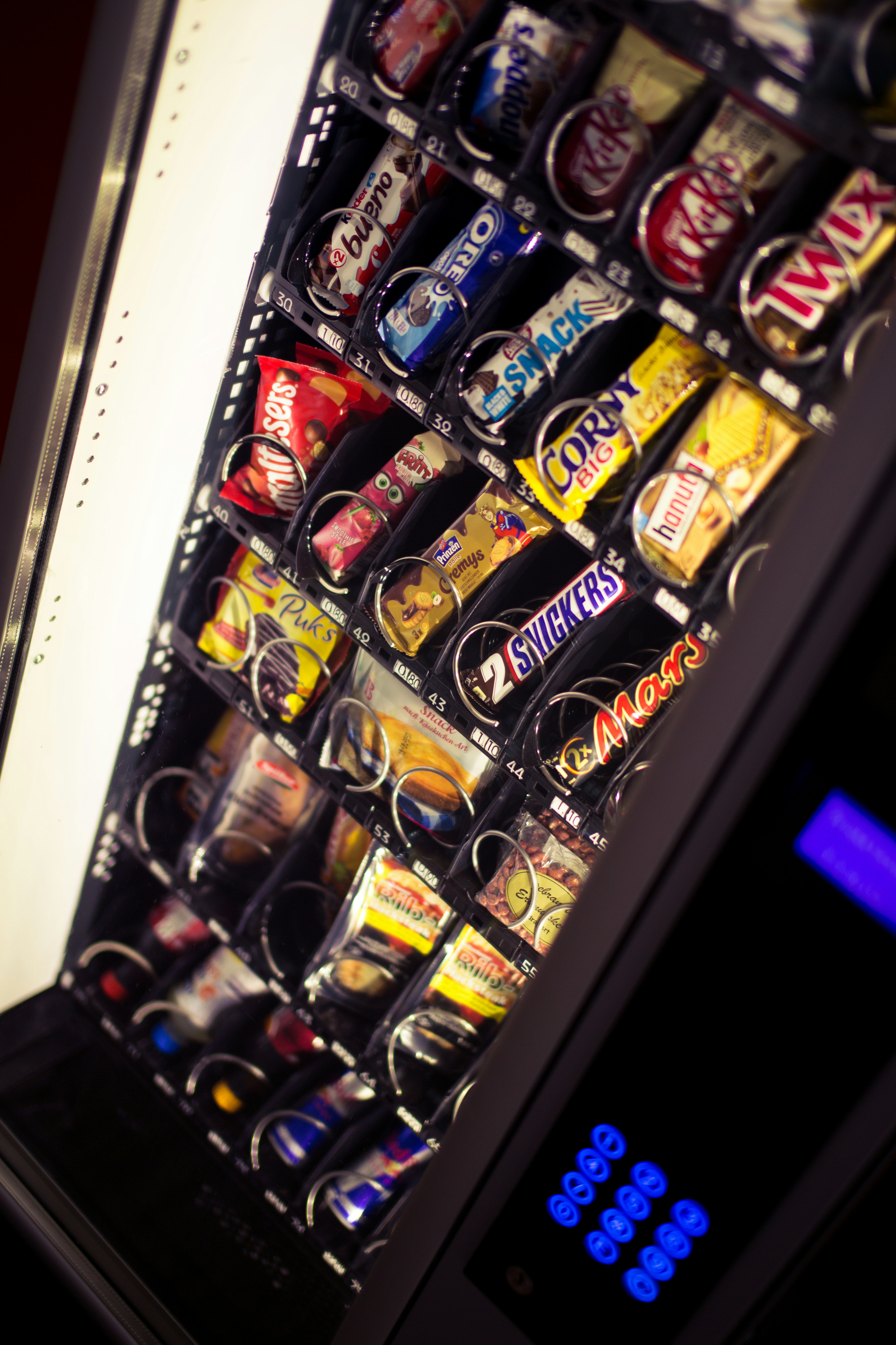 Modern Vendilicious vending machine stocked with drinks and snacks